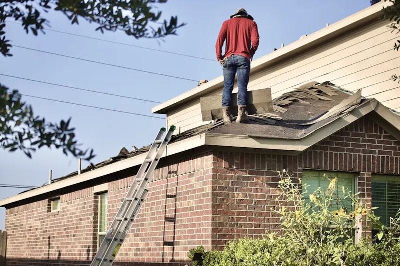 Professional roofer working on a residential roof in View Ridge Madison